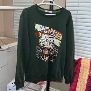 Dark green crew neck sweatshirt with cheetah design